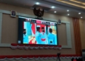 Momen saat Pasukan Pengibar Bendera, Aditya Yogi Susanto perwakilan dari Provinsi Gorontalo siap mengibarkan sang Merah Putih. Selasa (17/8/2021). (f. Anki/nn)