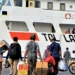 Pemudik bersiap memasuki KM Sabuk Nusantara 92 di Pelabuhan Tanjungwangi, Banyuwangi, Jawa Timur, Minggu (26/5/2019). Melonjaknya jumlah pemudik tujuan kepulauan seperti pulau Sapeken dan Sapudi, mengakibatkan sekitar 150 calon penumpang tidak mendapatkan tiket, karena kapasitas KM Sabuk Nusantara 92 hanya mampu menampung sebanyak 400 penumpang. ANTARA FOTO/Budi Candra Setya/ama.