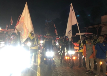 Bupati Gorontalo Utara Thariq Modanggu memimpin kirab bendera pataka KPK Gorontalo Utara. (f.ist)