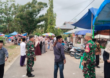 Anggota Kodim Pohuwato saat ikut melakukan penjagaan di kegiatan majelis taklim akbar Randangan-Taluditi