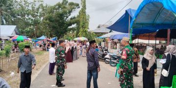 Anggota Kodim Pohuwato saat ikut melakukan penjagaan di kegiatan majelis taklim akbar Randangan-Taluditi